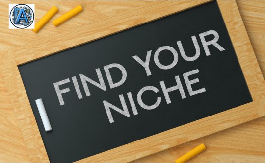 a chalk with words written on a small black chalkboard tablet find your niche